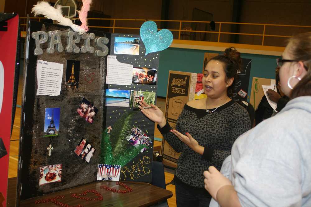 Students learn about displays presented by Ms. Camerons senior English classes during an event Jan. 17 in the small gym.