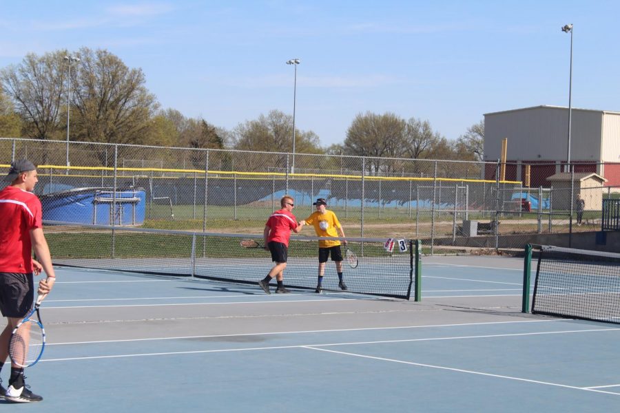 Freshman Luke Foster shakes hands with his Fort Osage opponent after a competitive match.
