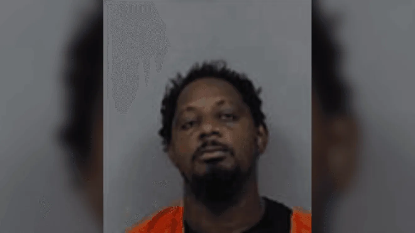 A jail booking area and court records tied to a sexual abuse arrest in Iowa
