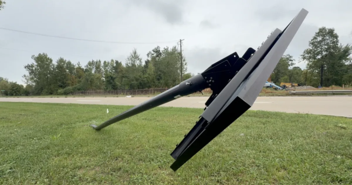 A Flock license plate reader camera mounted on a roadside pole in West Bloomfield Township