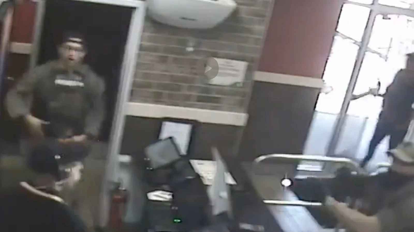 Police and DEA agents inside a Burger King during a fatal shooting investigation in Memphis